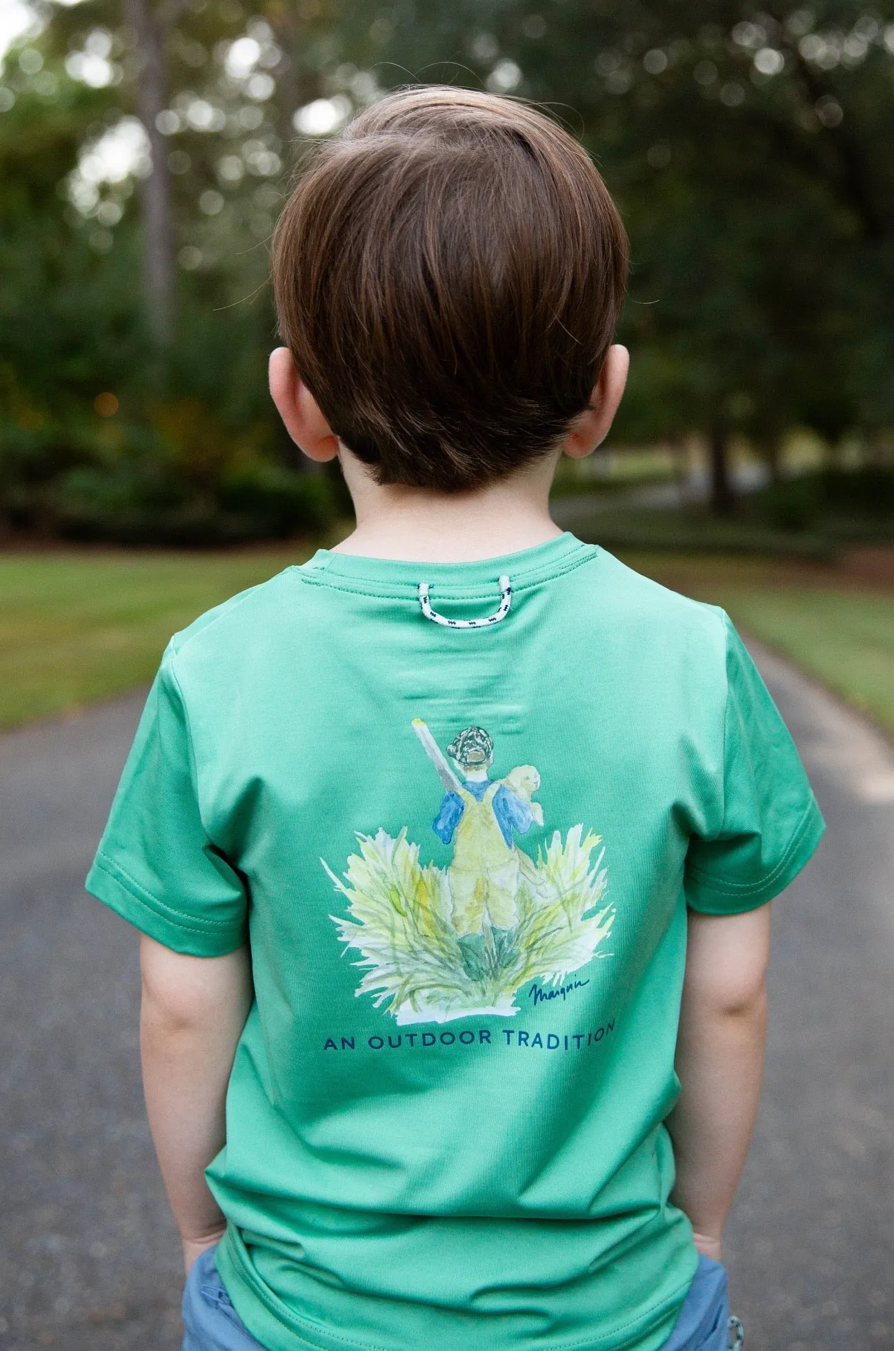 Kids Pro Performance Short Sleeve Fishing T-shirt in Green Spruce Boy and his Lab Puppy