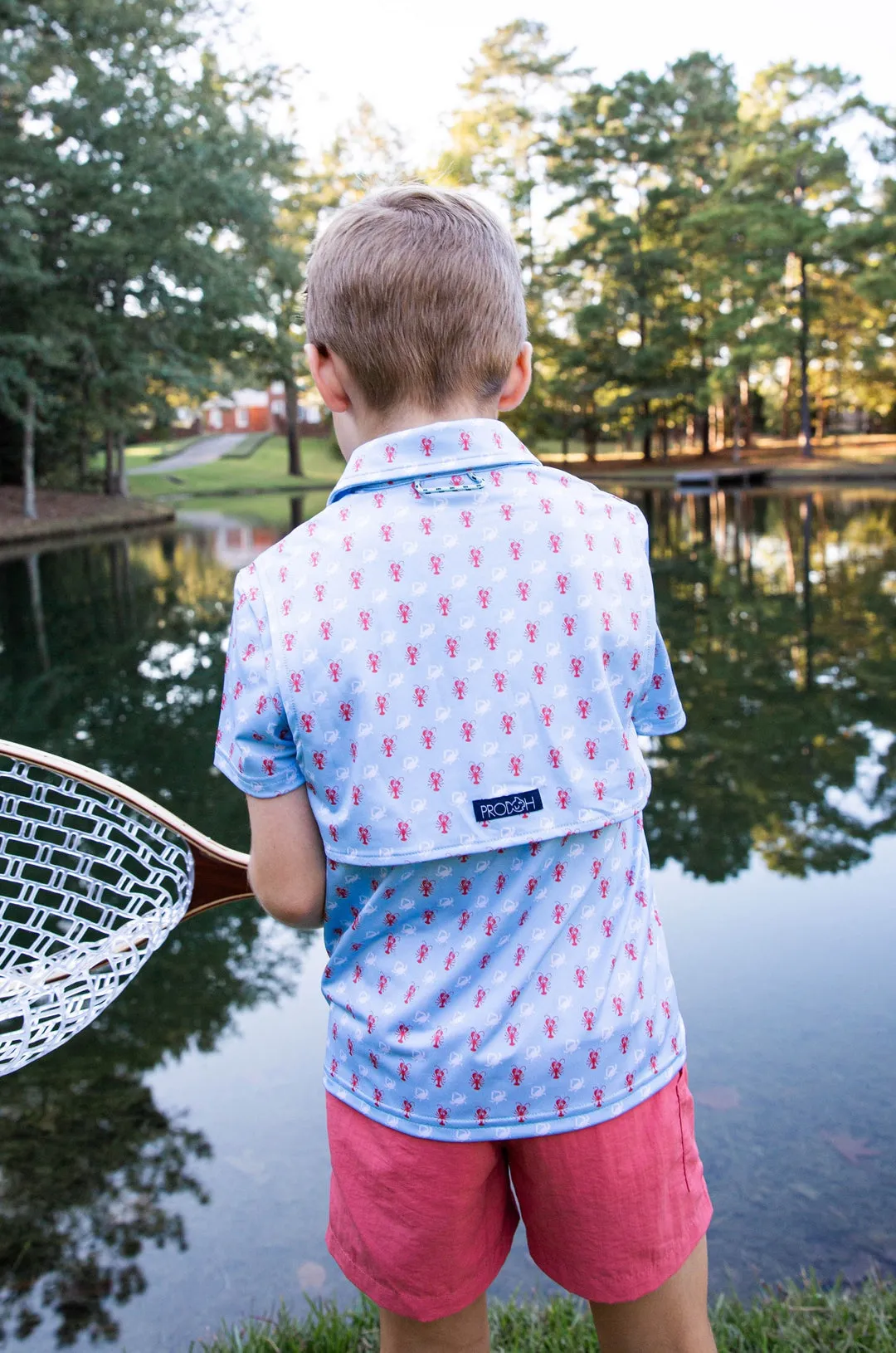 Short Sleeve Pro Performance Polo | Crab and Lobster Print on Light Blue